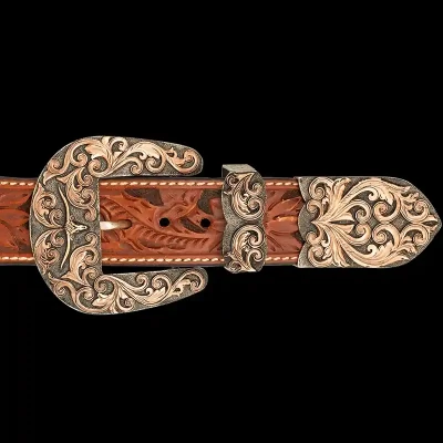 A custom western three piece belt buckle set featuring a longhorn figure 